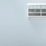 man fixing AC Heat mode